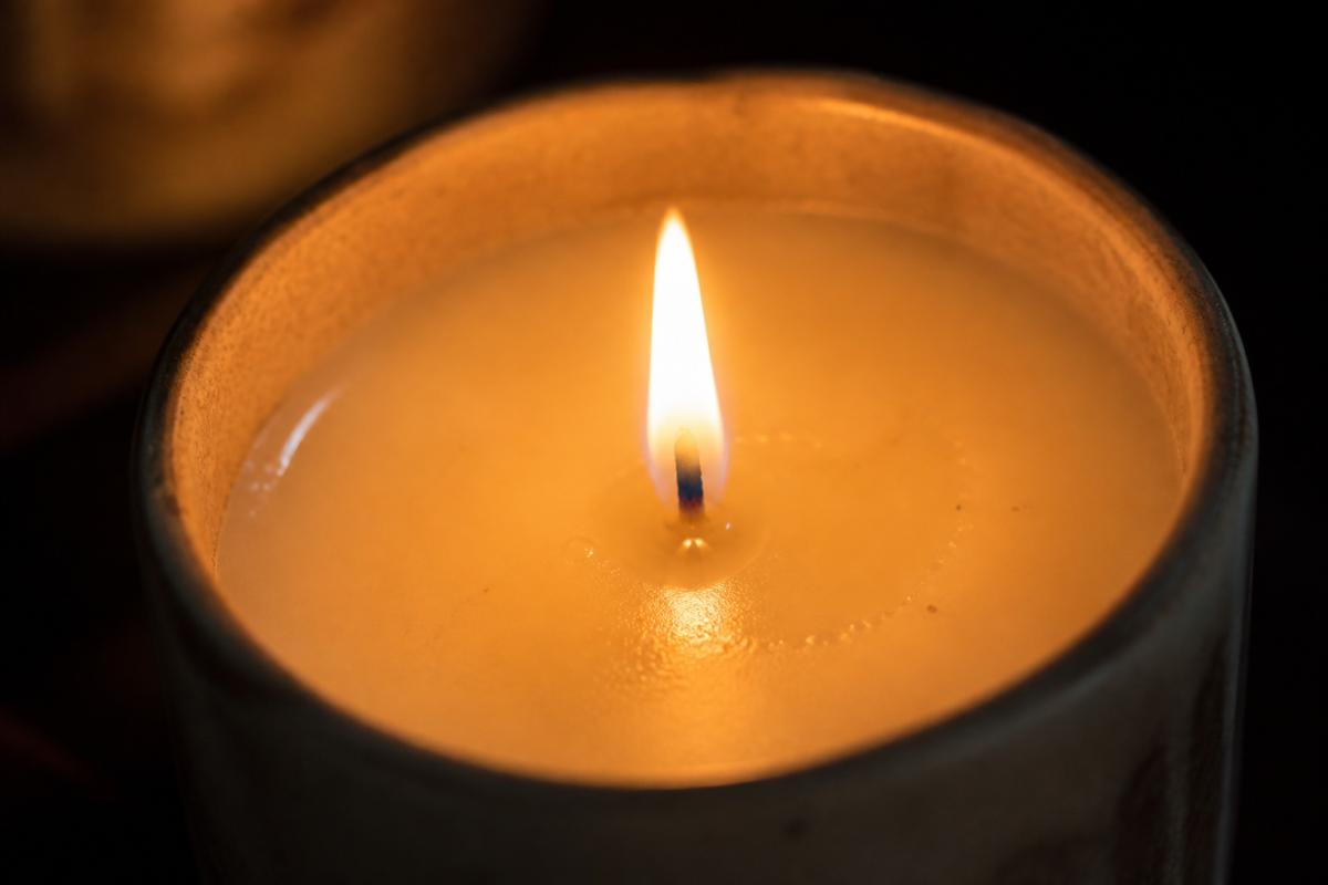 Lit pillar candle
